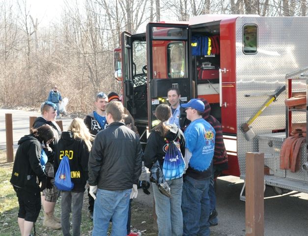 Helpers gathered around by the fire truck